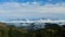 High Tatras above clouds with forested hills in the foreground, Tatras, Slovakia