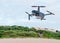 The high-tech drone flying in the sky. Drone with professional camera takes pictures. Copter with high resolution
