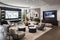 a high-tech family room with sleek furniture, large screens, and motion sensors for interactive games