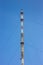 High telecommunications tower with antennas