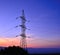 High tension tower on colorful sky at dawn