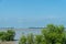 High tide mangrove forest with steamship and blue sky background at Tanjung Piai National Park, Malaysia