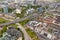 High top view of long motorway and many roofes of city houses fr