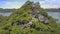 High Upper View Girl Figure on Large Sharp Rocks