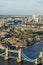 A high vantage view of London Bridge in the foreground and the East of London and River Thames.