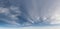 High velocity streaky wind formed clouds panorama