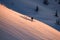 high view of active male skier sliding down on mountain slope