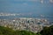 High view angle picture of Kobe cityscape crowded with houses and buildings with seashore and oil refinery industry