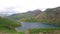 High view looking down over lake on PYG trail on Mount Snowdon in Snowdonia National Park, Wales, UK