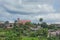 High view of a neighborhood in Mbalmayo, with a chapel in the distance