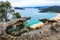 High view over ocean and beach through rocky outcrop