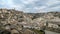 High view of town architecture skyline of matera,italy,people motion timelapse