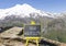 High volatility symbol. Concept words High volatility on beautiful black chalk blackboard. Chalkboard. Beautiful mountain Elbrus