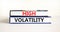 High volatility symbol. Concept words High volatility on beautiful books. Beautiful white table white background. Business high