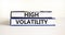 High volatility symbol. Concept words High volatility on beautiful books. Beautiful white table white background. Business high