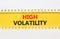 High volatility symbol. Concept words High volatility on beautiful yellow paper. Beautiful white table white background. Business