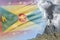 high volcano blast eruption at day time with white smoke on Grenada flag background, troubles because of disaster and volcanic