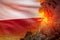 high volcano blast eruption at night with explosion on Poland flag background, suffer from disaster and volcanic ash conceptual 3D