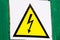 High voltage attention sign, do not touch. Black lightning on a yellow background in a triangle.