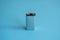 High voltage battery on a blue background. Silver Volt battery. 9V Advanced Lithium Batteries.