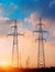 High voltage cable power post steel tower pylons in sunset scene twilight vintage color tone