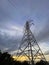 High voltage cable tower with cloudy sky