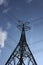 High-voltage electric cable support towering towards the blue sky