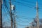 High Voltage Electric Pole with Fuse and Power Cable with bright blue sky