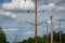 High Voltage Electric Pole with Fuse and Power Cable with bright blue sky as the background