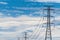 High voltage electric pole and transmission line. Electricity pylons. Power and energy. Energy conservation. High voltage grid