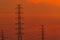 High voltage electric pole and transmission lines in the evening. Electricity pylons at sunset. Power and energy. Energy