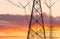 High voltage electric pole and transmission lines in the evening. Electricity pylons at sunset. Power and energy. Energy