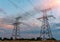 High voltage electric power steel tower in the setting sun, closeup of photo