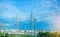 High voltage electric tower line. Silhouette of Power Supply Facilities with blue sky background