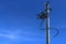 High Voltage Electricity Pillars Cables On Electricity Power Tower On Blue Sky Background. Transmission Lines.