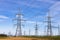 High voltage electricity pylons, transmission power lines, and distribution substation