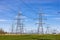 High voltage electricity pylons, transmission power lines, and distribution substations