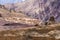 High voltage lines in Lamayuru moonland, picturesque lifeless mountain landscape on a section of the Leh-Kargil route