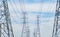 High voltage poles. Power lines on utility tower and cable wires in energy electric technology, network, and industry concept.