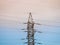 High voltage post or transmission tower and clear sunset sky as background