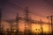 High voltage power plant at sunset, high voltage transmission tower