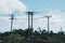 High voltage power pylons transmission huge metal concrete pole of overhead power line energy electric wires outdoor