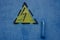 High voltage sign precaution on the metal wall, yellow and blue