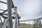 High voltage tower construction outdoors, closeup. Installation of electrical substation