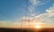 High voltage tower with electric power lines at sunset. Transmission of electricity