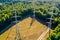 High voltage tower. High voltage. Electricity transmission power lines at sunset (high voltage pylon). Aerial view