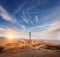 High voltage tower in mountains at sunset. Electricity pylon system