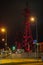 High voltage towers lightened with red light in evening