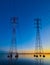 High voltage transmission lines crossing Wheeler Lake at dusk near Athens AL. Electricity pylons at sunset. Power and energy