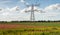 High voltages lines and a power pylon in a Dutch polder